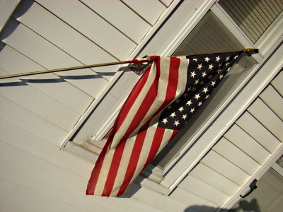 american flag, one room school house